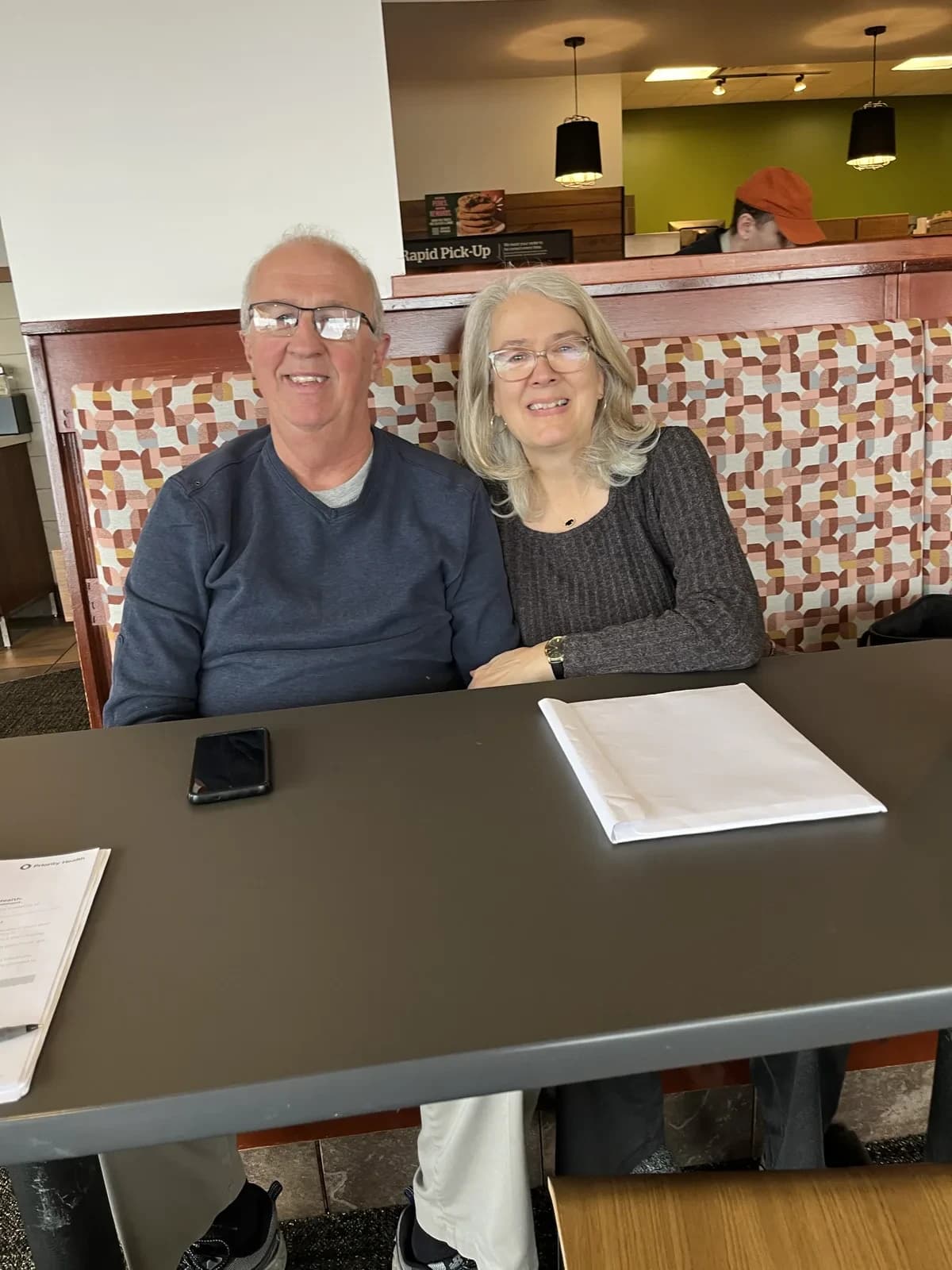 A couple meeting with Hunter Klaassen to review their Marketplace health plan options and estimate their savings