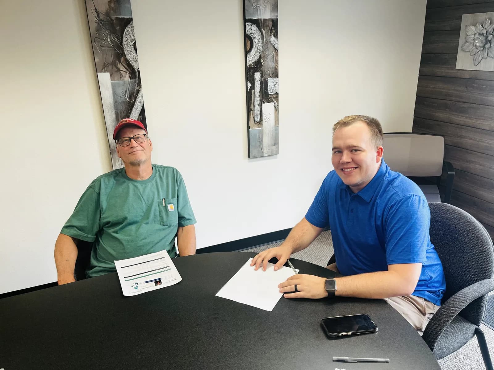 Hunter Klaassen meeting with a client to compare Medicare Advantage and Medicare Supplement plans in Jackson, MI